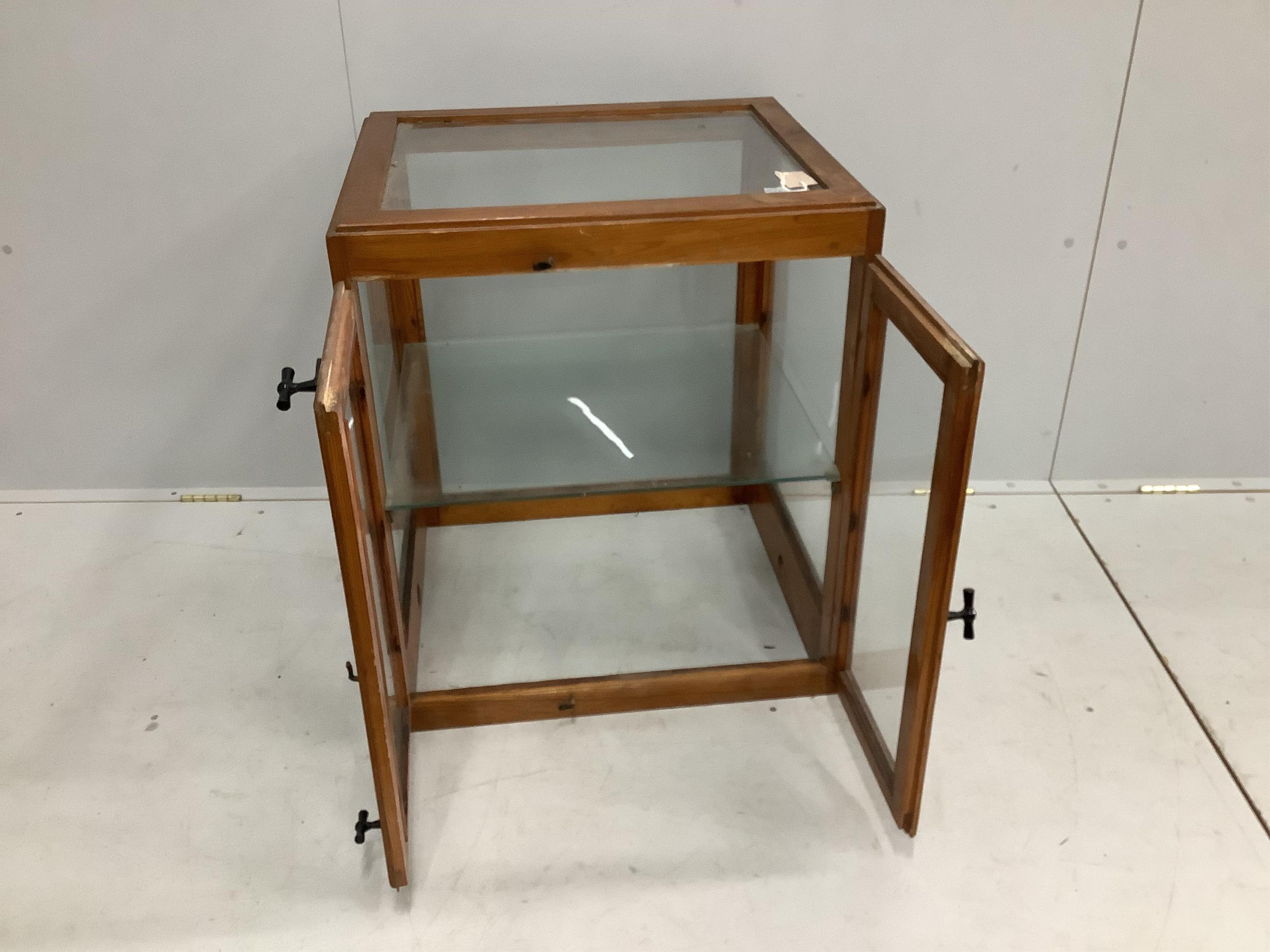 A mid 20th century glazed pine counter cabinet, width 62cm, depth 55cm, height 72cm. Condition - fair to good